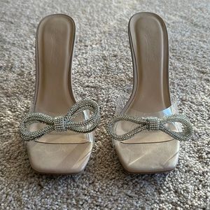 Nude/clear bow heels
